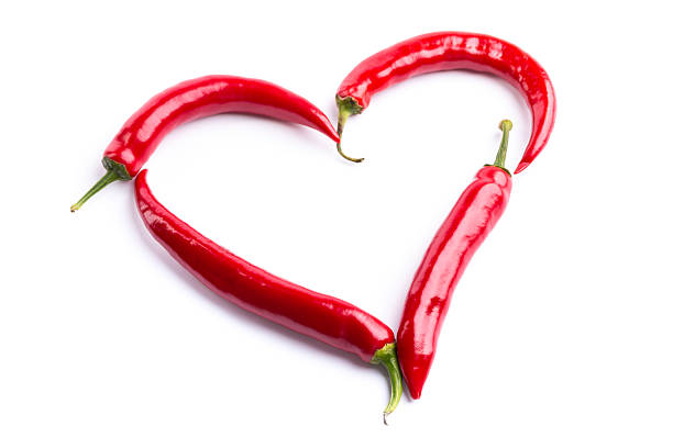heart shape made of red chili pepperssee my