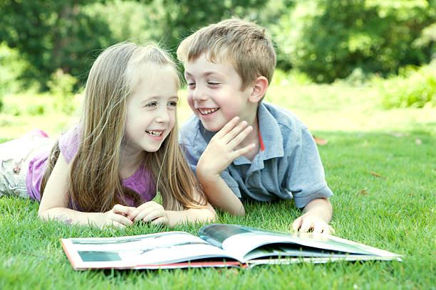 istock Children Reading in the Park 180752283