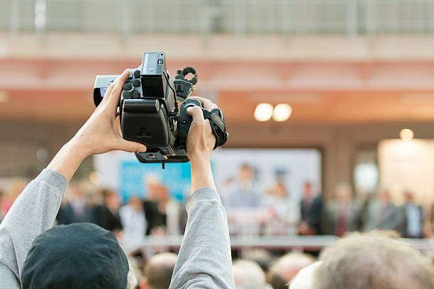 istock Cameraman recording an event 180752433