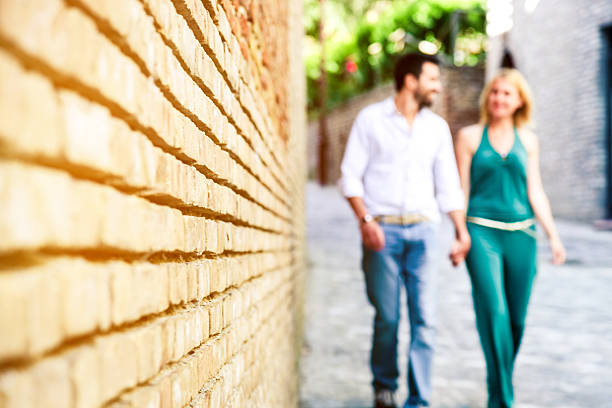 istock Couple walking in the old town 180752675