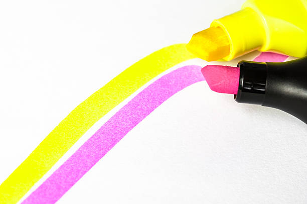istock Fluorescent pink and yellow highlighter traces 180752717