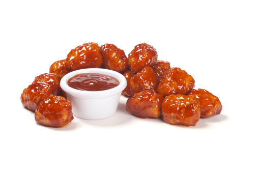 Honey barbecue boneless wings with honey barbecue sauce.