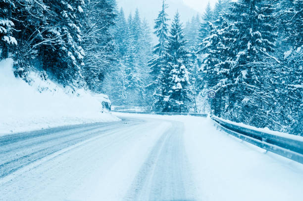 istock Mountain road landscape covered in snow in winter 1807536051