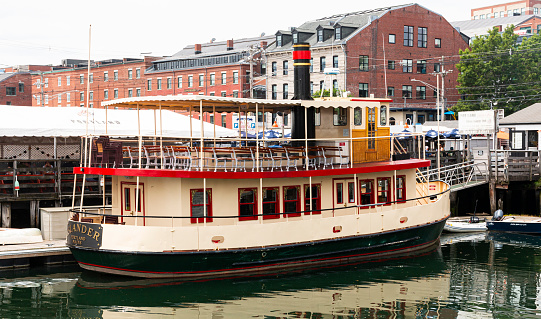 Portland, Maine, USA - 20 July 2019: A sightseeing party boat that is sitting in the water in Portland Maine USA.