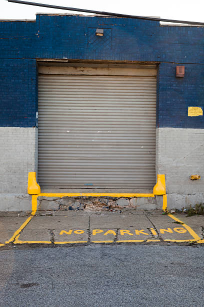 istock Loading entrance with NO PARKING sign on the sidewalk 180754666