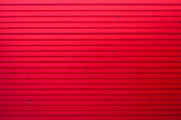 istock red stained plank of a wooden wall 180754895