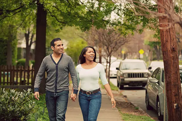 Photo of couple walking town