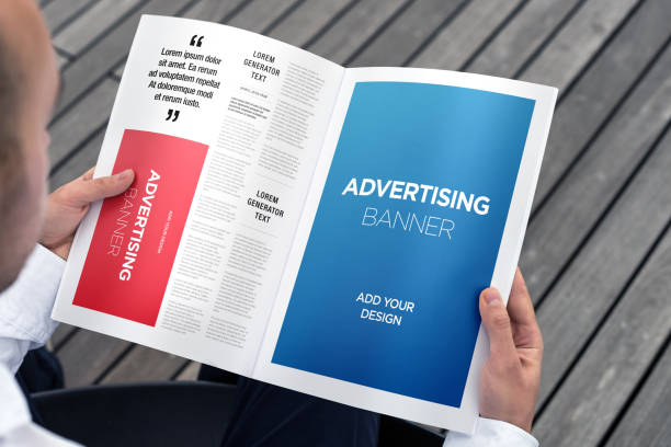 istock Hand Holding Newspaper Advertising Magazine Brochure Mockup 1807555709