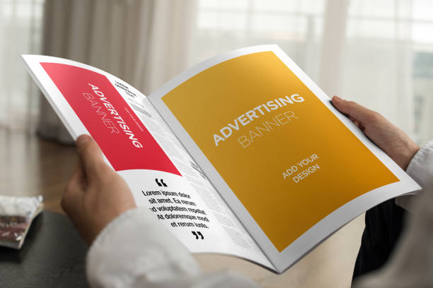 istock Hand Holding Newspaper Advertising Magazine Brochure Mockup 1807555712