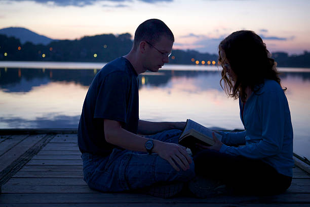 istock Couple Praying Together 180756296
