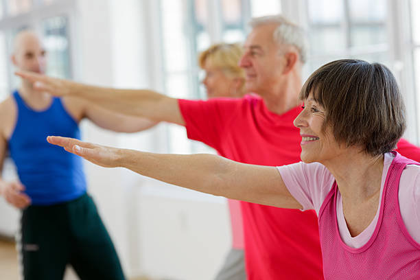 istock Group of seniors adults with Yoga Instructor 180756802