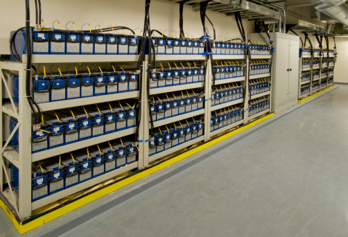 A rack of emergency batteries for a telecommunication and data transfer center.Click on any of the thumbnails below to see more electrical power rooms: