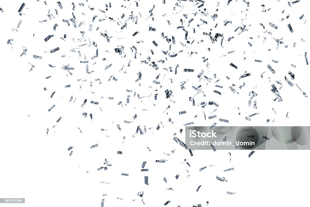 Silver metallic confetti falling, isolated on white background Silver metallic confetti falling against white background. Confetti Stock Photo
