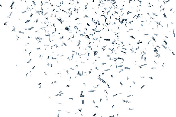 Silver metallic confetti falling, isolated on white background stock photo