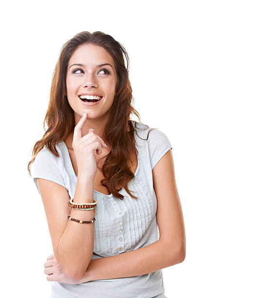 There we go! A thoughtful young woman looking away while isolated on a white background women beautiful studio shot isolated on white stock pictures, royalty-free photos & images