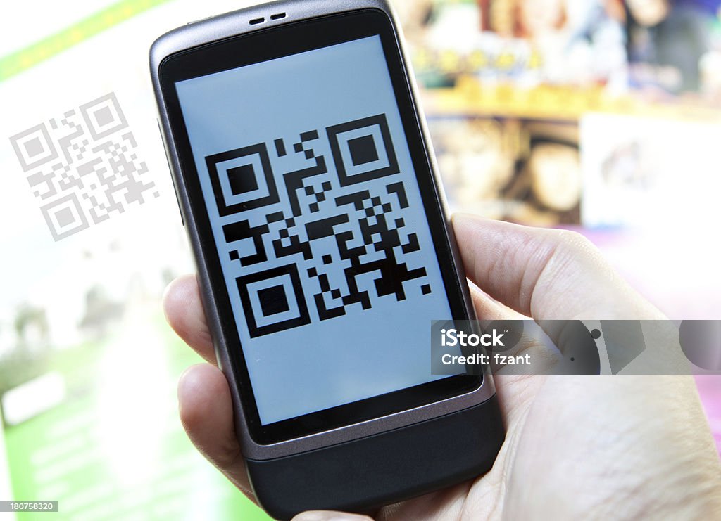 Smart phone show QR Code Hand hold a smart phone show QR Code,the mean is:Hello QR Code Business Stock Photo