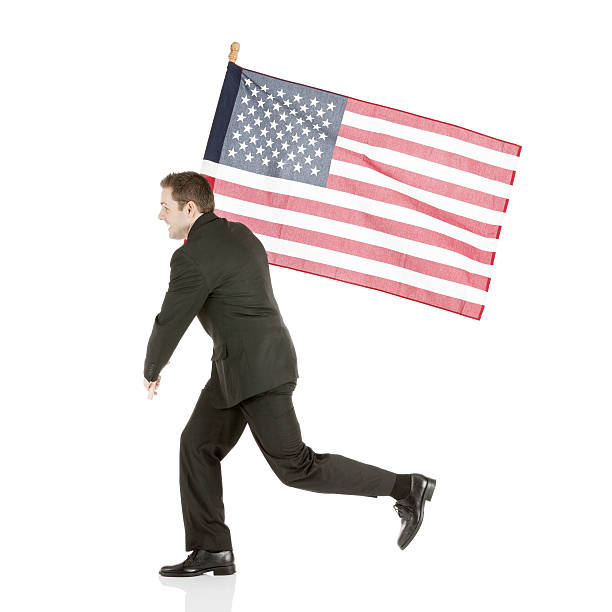 istock Business man running with flag 180758426