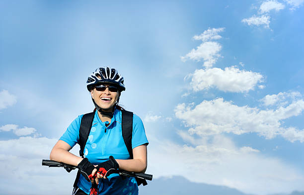 istock happy biker woman 180758515