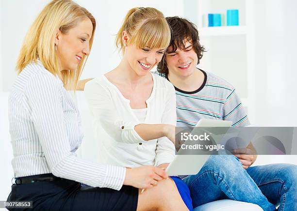 Cheerful Young Couple Meeting With Financial Advisor Stock Photo - Download Image Now