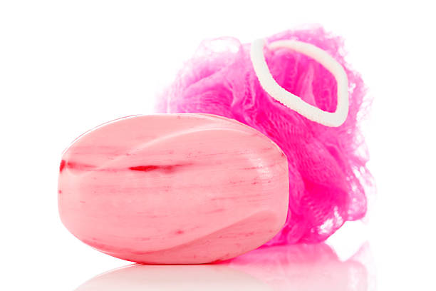 istock Pretty, pink toilet soap and mesh shower sponge 180758818