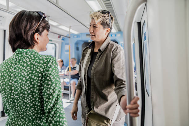 istock Friends talking in the subway train 1807591144