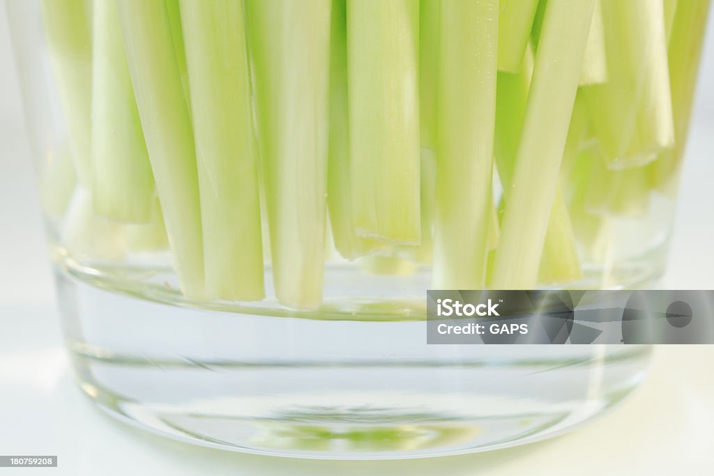 tulip stems in a glass vase At The Bottom Of Stock Photo