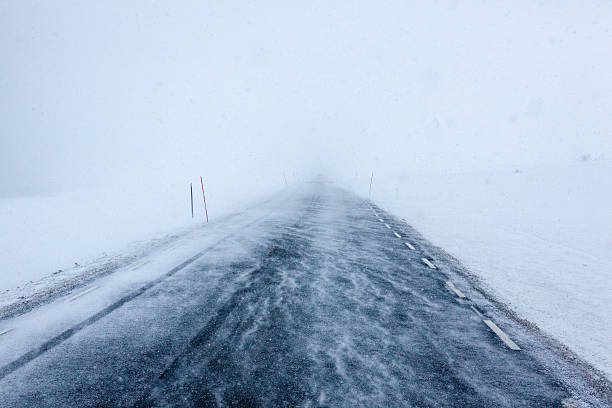 istock Dangerous winter road during snow storm in Norway 180759685