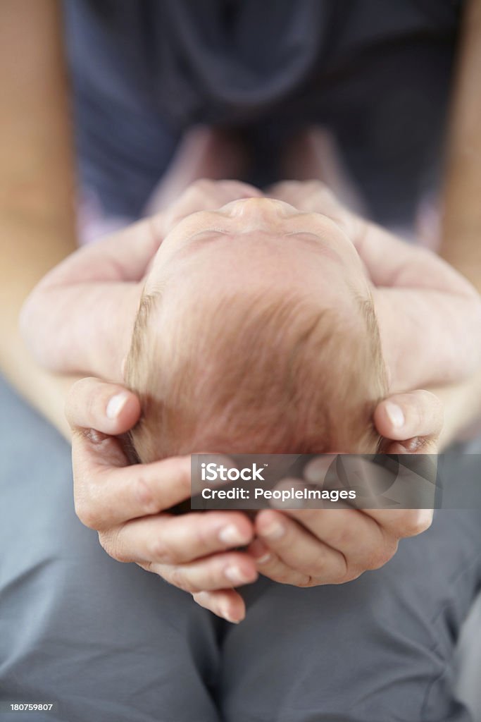 The future in her hands Closeup cropped shot of a mother cradling her baby on her lap Baby - Human Age Stock Photo