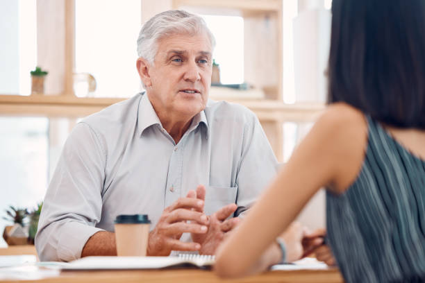 istock Senior businessman, team and talking with coffee for planning strategy, creativity collaboration and startup marketing meeting. Teamwork, employee discussion and business people morning consultation 1807598863