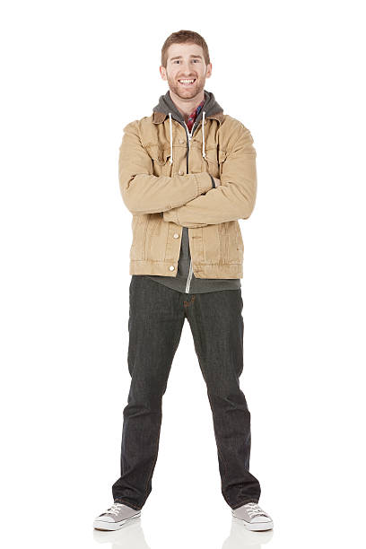 istock Happy young man standing with his arms crossed 180759914