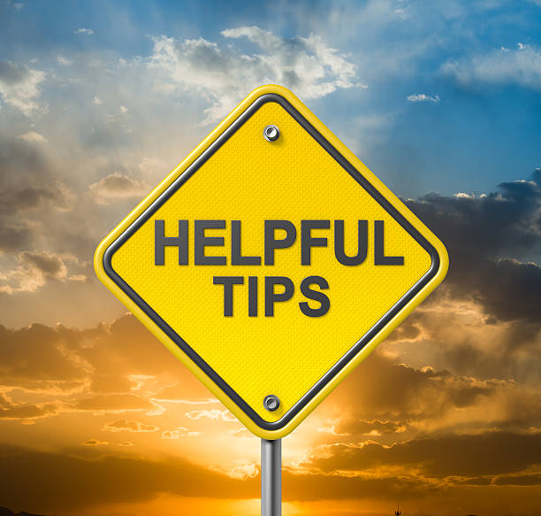 istock A traffic sign with the words Helpful Tips during sunset 180759979