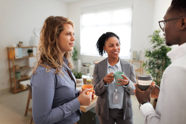 istock Colleagues having coffee break at the office 1807604435