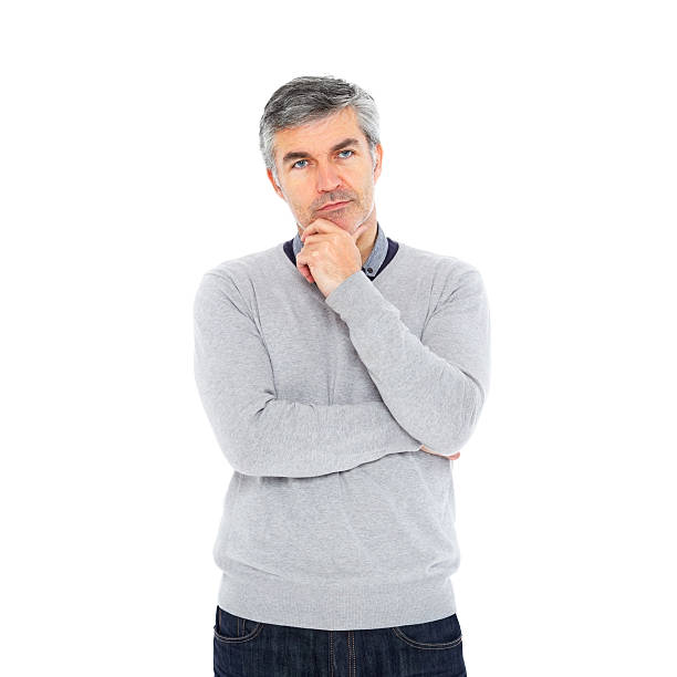istock Thoughtful mature man looking at camera against white 180760465