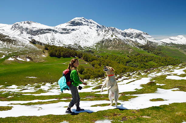istock Girl with dog in the spring Pyrenees 180760467