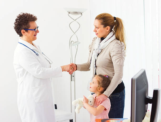 istock Mother and her daughter during visit at the doctor's office. 180760588