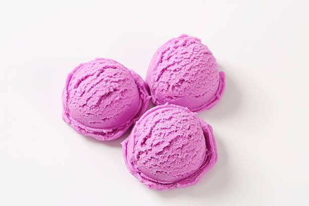 istock Three scoops of purple ice cream on white background 180761064