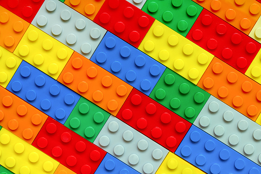 Multicolored Toy Bricks Design: Diverse Construction Elements Background. Idea, creative concept