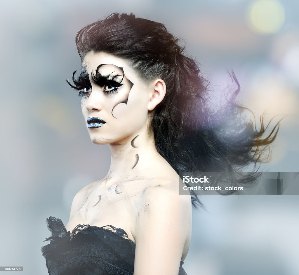 fashion woman attractive gothic woman with dark makeup on defocused background. Adult Stock Photo