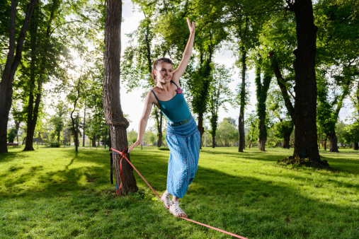 Beautiful girl balancing on a rope