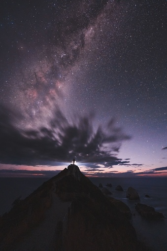 A scenic view of Nugget Point at night, New Zealand