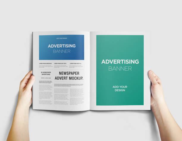 istock Hand Holding Newspaper Advertising Magazine Brochure Mockup 1807619423