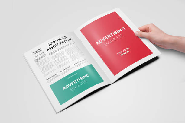istock Hand Holding Newspaper Advertising Magazine Brochure Mockup 1807619976