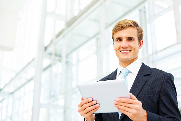 istock Happy Businessman Holding Digital Tablet 180762731