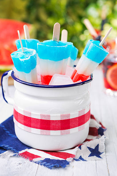 istock Red-white-and-blue popsicles on an outdoor table with summer drinks 180762742