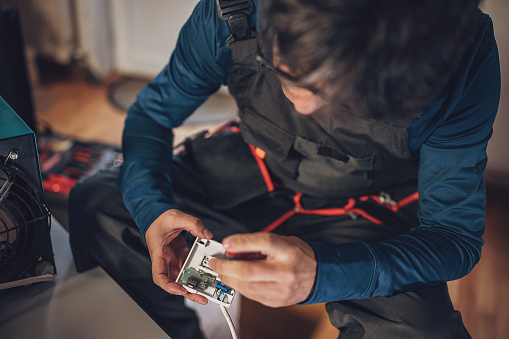 Electrician repairing electronics and electricity at home