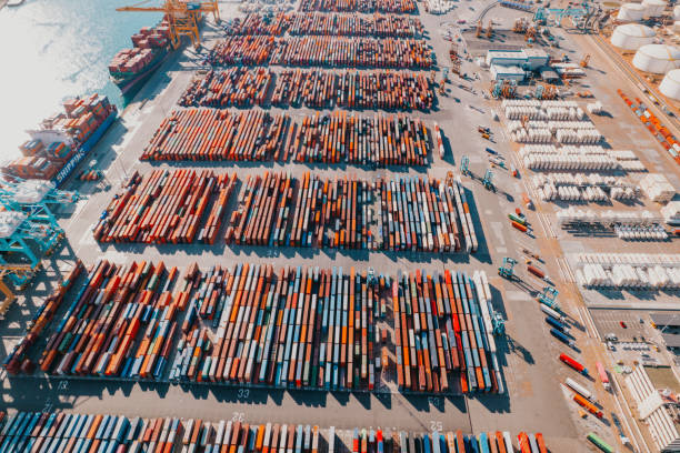 istock Commercial Dock With Containers And Cranes 1807669500