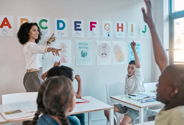 istock Diversity, education and teacher with class, question and learning for child development, growth and smile. Black woman, educator and children with answers, prepare for test, exam and conversation 1807675620
