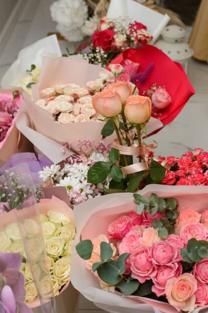 istock Ready bouquets of roses in gift paper. 1807684674