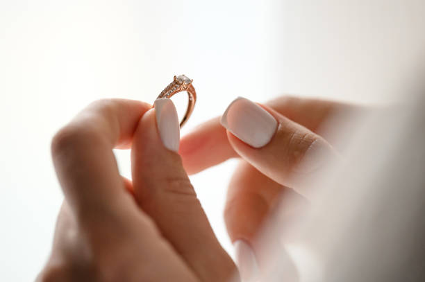 istock The bride is holding her engagement ring in her hands. 1807692273