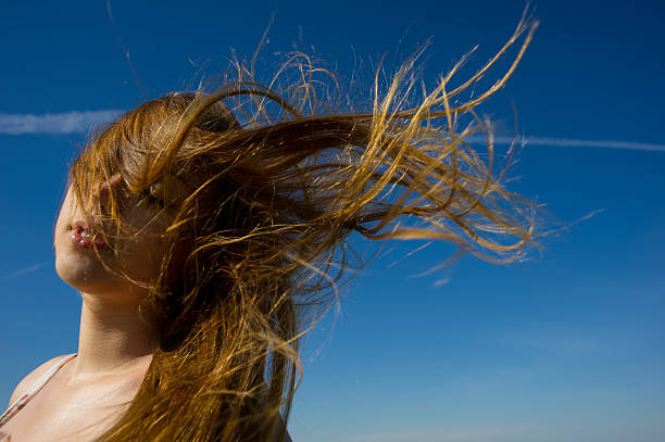 istock woman face  a flowing hair 180769954